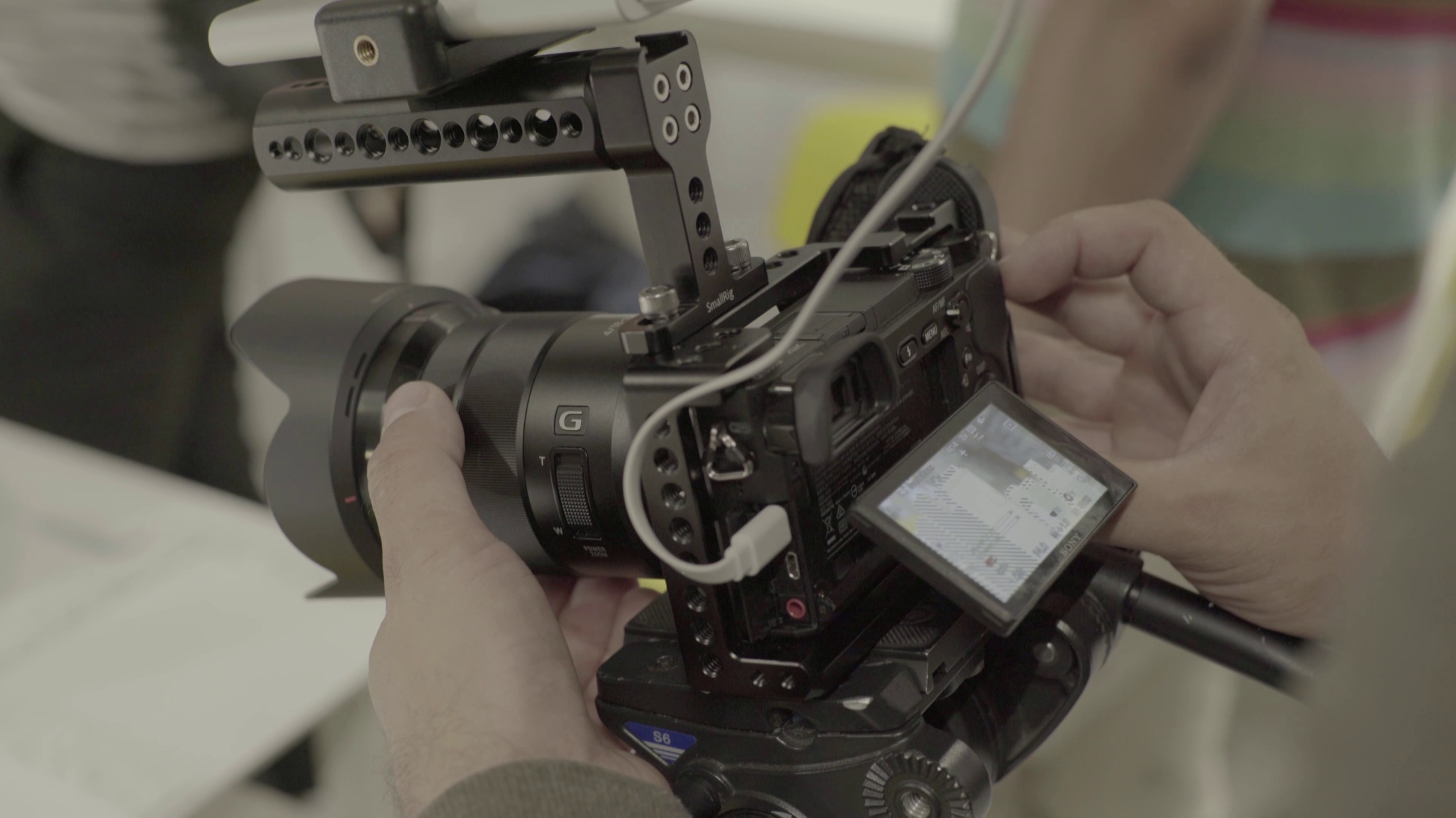 Camera operator preparing a professional video production camera